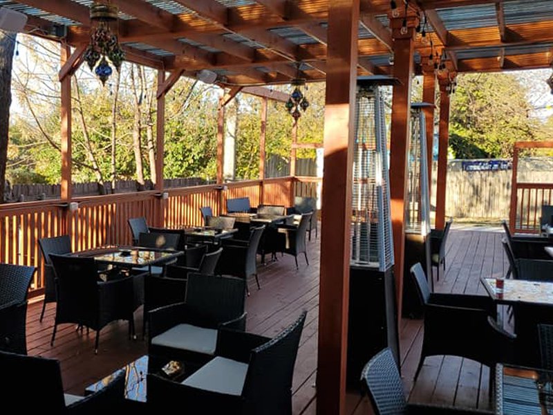 Outdoor patio dining in the South Austin shade