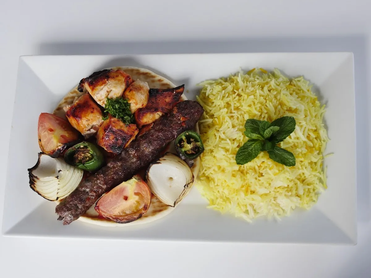 Halal mixed grill skewers over rice at Mezze Cafe, a fully halal Mediterranean restaurant in Austin, TX