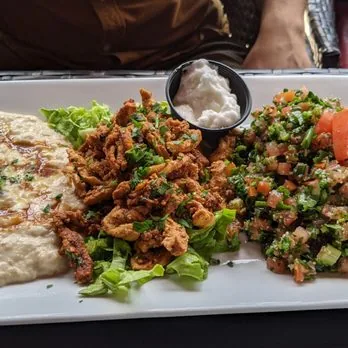 Chicken shawarma plate with hummus, tabbouleh and garlic sauce at Mezze Cafe Austin