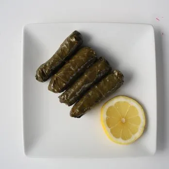 Dolmas, stuffed grape leaves with lemon, at Mezze Cafe Austin