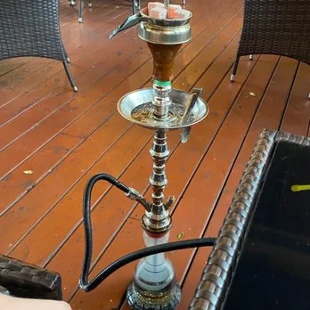 Glass hookah pipe on the lounge deck at Mezze Cafe Austin