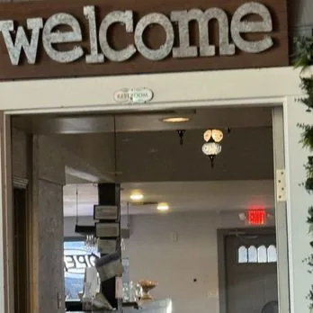 Welcome entrance with chandeliers at Mezze Cafe Austin